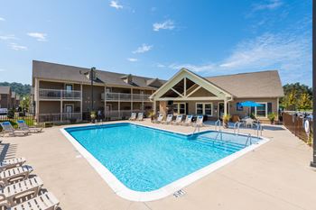 Zero entry saltwater swimming pool with tanning shelf and sundeck